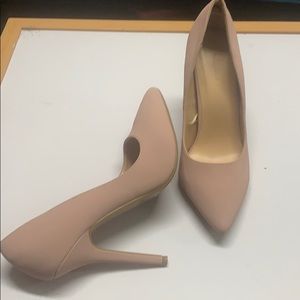 Pair of light creamy pink pumps.